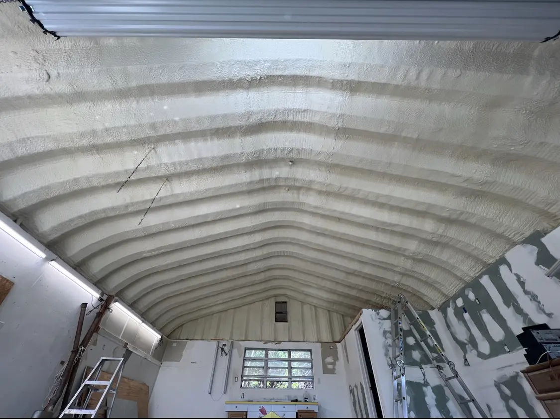 Spray polyurethane foam applied to the underside of a metal roof deck in Whitfield
